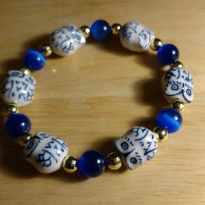 7-7 1/2 owl bracelet with blues glass beads